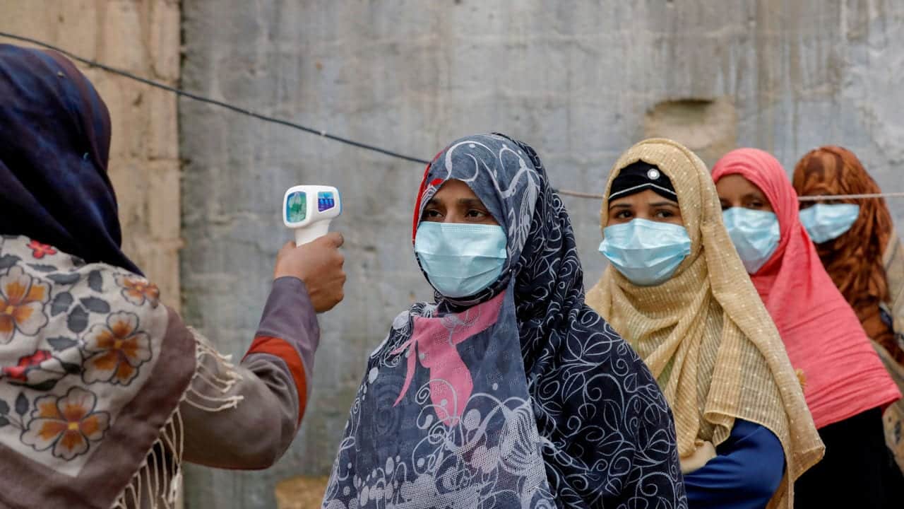 Female Polio Vaccinators receiving their Covid temperature