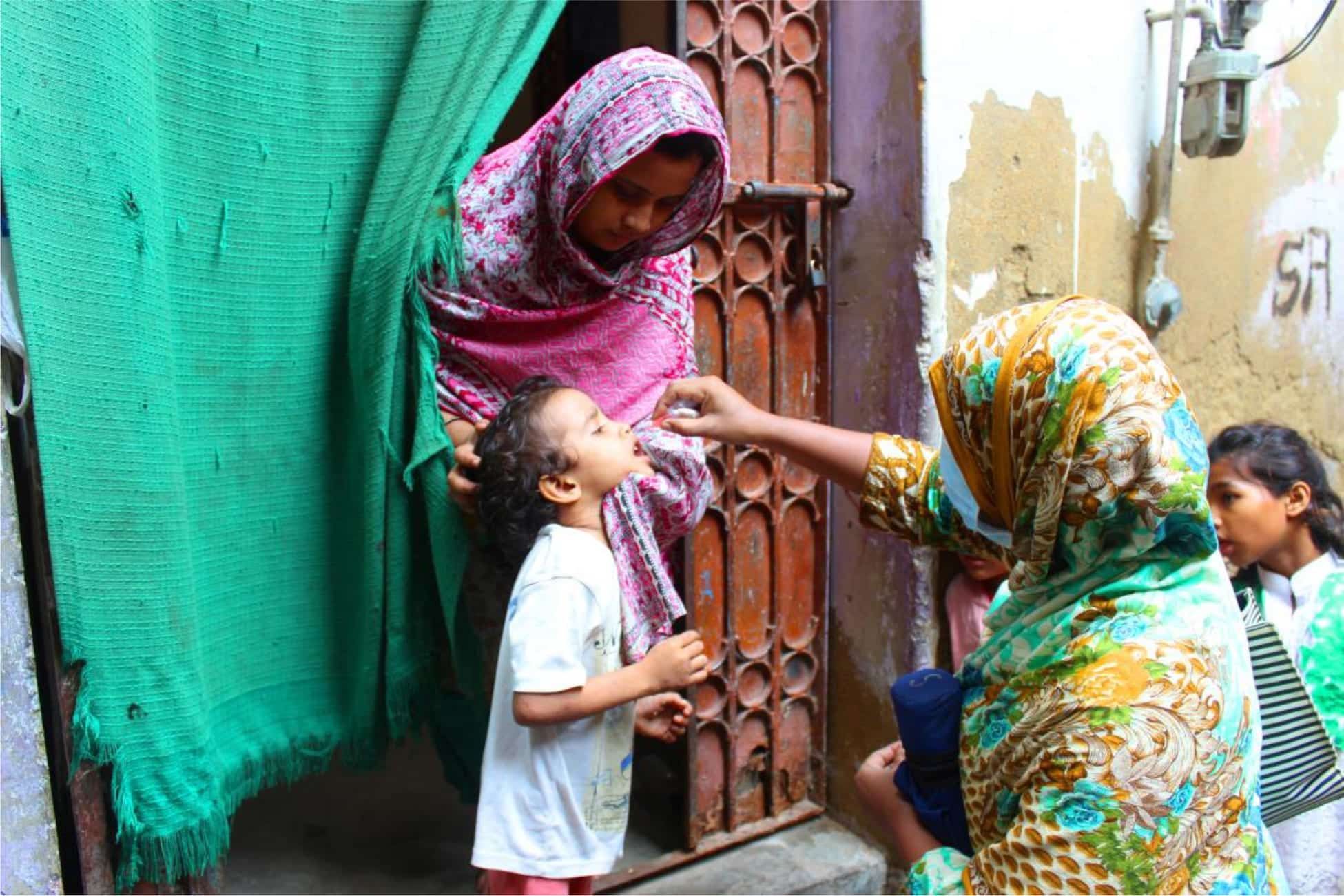 A child is vaccinated in Sadder Town, Karachi, Pakistan