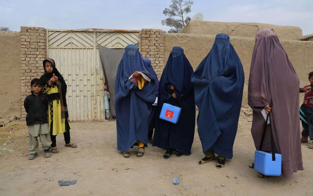 Female Vaccination Team immunize children in Afghanistan